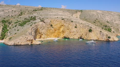 Beautiful-cliffs-and-secret-beach,-calm-lagoon-on-the-coast-of-the-Croatian-island
