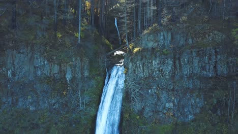 Stunning-4k-aerial-footage-of-a-waterfall-in-Oregon,-United-States---Wahkeena-Falls-Tourist-Destination