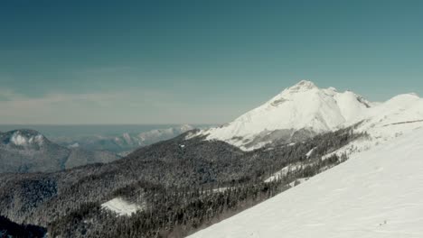 Snowy-Winter-Slopes-in-Russia-Mountain-Ski-Resort---Aerial-Establisher