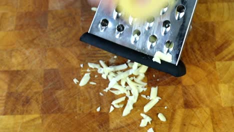 Grating-Hard-Cheese-on-a-Grater