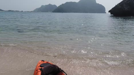 Preparing-for-an-amazing-kayak-adventure-over-the-clear-waters-of-the-Phi-Phi-Islands-in-Thailand---tilt-up