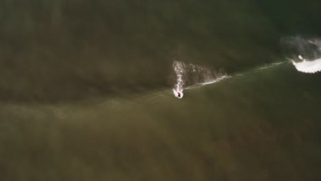 Aerial:-good-bodysurfer-catching-wave-on-peak,-bird's-eye-view
