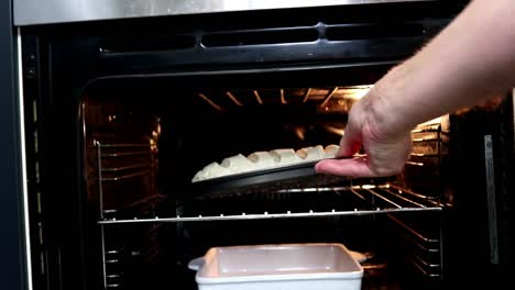Putting-Bread-in-to-The-Oven-for-Baking