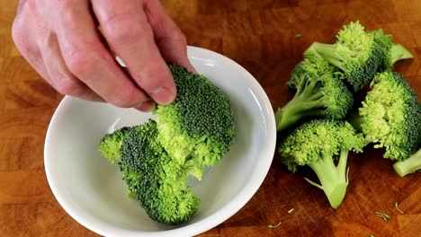 Placing-Broccoli-Florets-in-to-a-Bowl