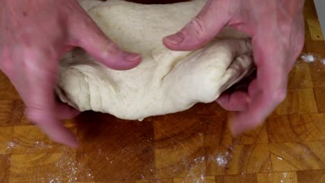 Stretching-Dough-by-Hand-in-to-Shape
