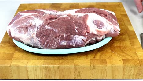 Preparing-Pork-Meat-To-Be-Sliced