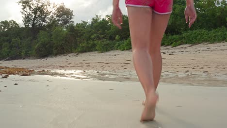 Woman-in-Swimsuit-Walking-on-Tropical-White-Sand-Beach-and-Stream-in-Evening-4K