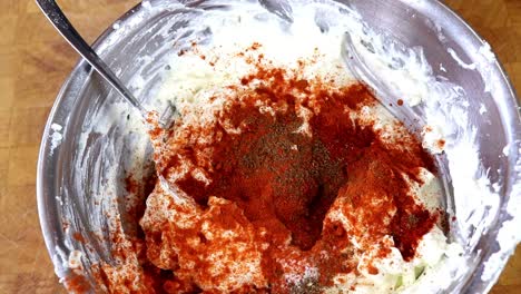 Sprinkling-Chilly-Powder-Over-Cottage-Cheese-Dip