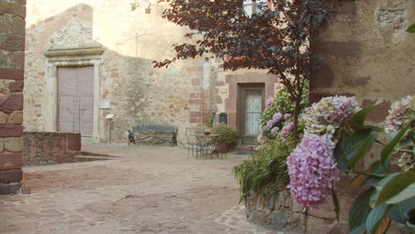 Entrance-of-a-church-in-a-small-rural-town-in-Spain-whit-some-flowers