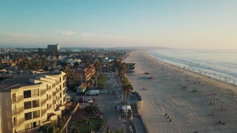 Amazing-4k-aerial-view-of-the-San-Diego-promanade-and-coastline-while-sunset---Pacific-Beach-California