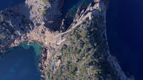 4k-top-down-shot-of-spanish-rocky-coastline---Sa-Foradada-Mallorca,-Serra-de-Tramuntana---Westcoast---Calm-turquoise-Mediterranean-Sea