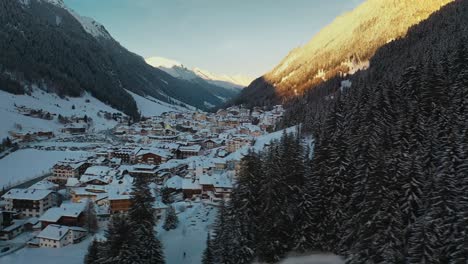 Beautiful-ski-resort-village-in-Austrian-Alps-mountain-valley,-winter-aerial