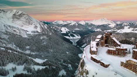 Avoriaz-ski-resort-at-sunset-in-French-Alps,-4K-winter-aerial-landscape