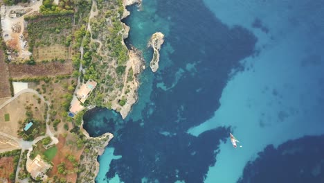 Breathtaking-top-down-shot-in-4k-of-Es-Pontas-in-Mallorca---Majorca-Spain-with-sailing-boats-in-quiet-Mediterranean-Sea