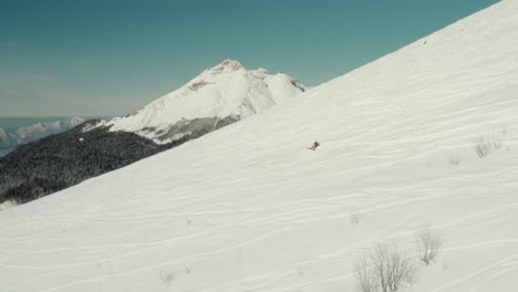 Snowboarder-Person-on-Ski-Slopes-Enjoying-Fresh-Powder-Snow