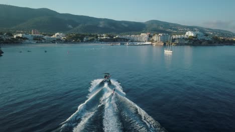 Stunning-drone-footage-in-4k-of-person-wakeboarding-in-Mallorca---Palmanova-beach---Magaluf---Waterskiing---Activities-outdoor,-Mediterranean-Sea,-Belearic-Islands,-Spain