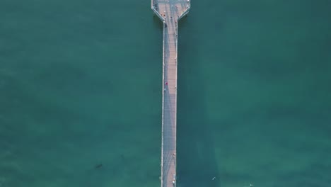 4k-top-down-aerial-shot-of-the-Crystal-Pier-in-San-Diego-at-Pacific-Beach,-southern-California