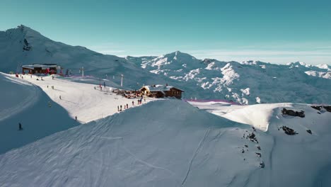 Aerial:-amazing-Val-Thorens-ski-resort,-French-Alps-peaks