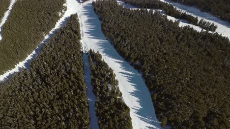 Beautiful-Aerial-View-of-Ski-Resort-Slope-Paths-in-Snowy-Mountain-Landscape