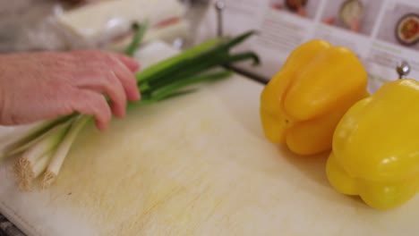 Close-Up-Of-Woman-Placing-Food-On-Cutting-Board-In-4K