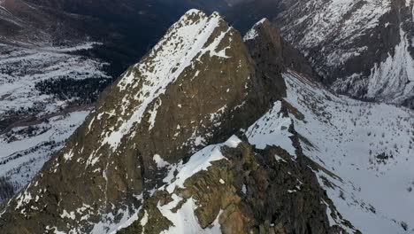 Aerial-Nature-Landscape-of-Rocky-Snowy-Peak-in-European-Mountain-Alps