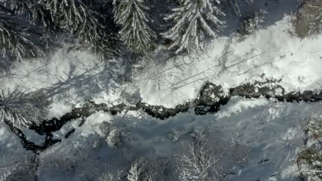 Stream-in-Wintry-Snowy-Mountain-Landscape-in-Austria-Alps