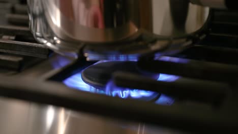 Close-Up-Of-Stove-Pilot-Light-Turning-On-In-Slow-Motion