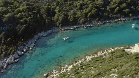 Boats-in-Mediterranean-Lagoon-River-on-Greece-Island-of-Corfu,-Aerial