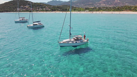 Aerial-People-Relaxing-on-Boat-at-Sardinia-Tropical-Sea