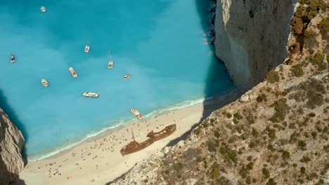 Aerial-establishing-reveal-of-Shipwreck-Beach-Smugglers-Cove-in-Greece