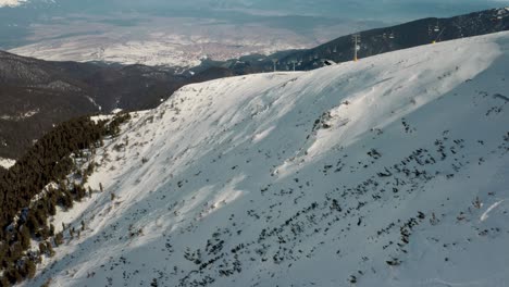 Bansko-Ski-Resort-Snow-Mountain-in-Bulgaria,-Europe---Aerial-Drone