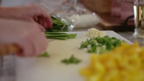 Close-Up-Of-Woman-Preparing-Snow-Peas-In-Slow-Motion