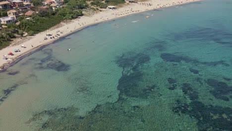 Aerial-View-of-Bay-with-People-at-Beach