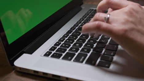 Woman-Hands-Typing-on-Laptop.-Green-Screen-Background