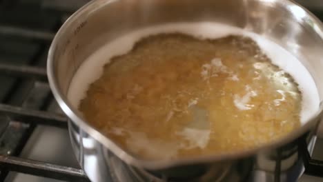 Close-Up-Of-Pasta-Cooking-In-Pot-Of-Boiling-Water-In-Slow-Motion