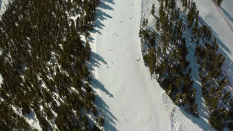 Skiiers-on-Snowy,-Ski-Resort-Slope-Paths