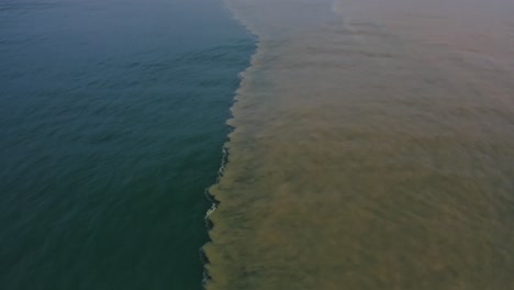 Aerial:-natural-phenomenon,-seawater-mixing-with-river-freshwater-in-ocean