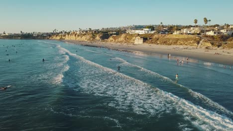 San-Diego-surfers-at-Pacific-Beach---What-to-do-in-San-Diego---Highlights---California-coastline---4k-aerial-footage