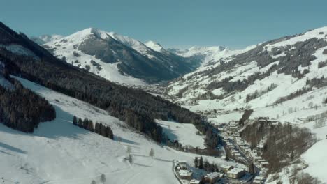 Ski-Resort-in-Snowy-Austrian-Alps-Mountains---Aerial-Drone-Establisher
