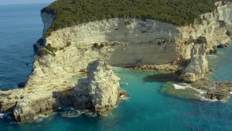 Rocky-Eroded-Greece-Coast-of-Paxos-Island-in-Ionian-Sea,-Aerial-Establisher