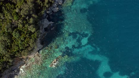 Aerial-Overhead-of-beautiful-coral-reefs-on-Ionian-Ocean-Greece-Coast