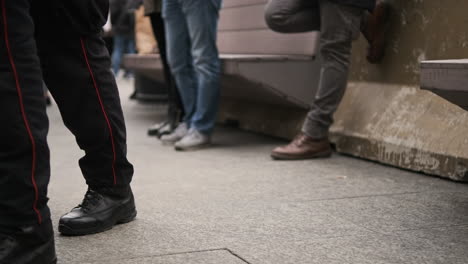 Legs-Of-Carabinieri-In-Milan-Italy,-Military-Police-Force-Wearing-Boots-Walking-Outside-On-A-Concrete-Floor