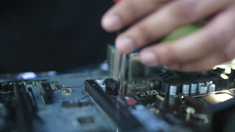 Man-Screwing-Part-On-Motherboard