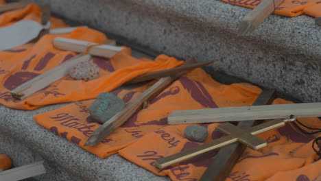 Shot-of-the-BC-Legislative-Assembly-buildings-with-a-memorial-for-Indigenous-Children-victims-on-the-front-steps-in-Victoria-BC,-close-up-of-orange-shirts-in-memory-of-the-victims