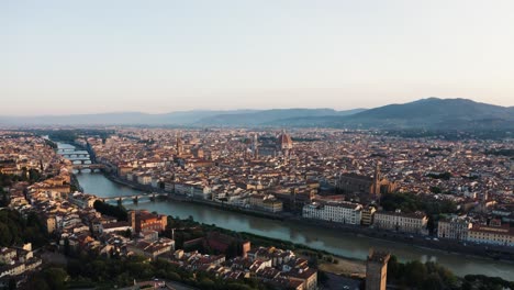 Backwards-Aerial-Of-Florence-With-Arno-River-And-The-Duomo