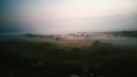 Drone-Shot-on-Farm-in-the-morning-with-low-clouds