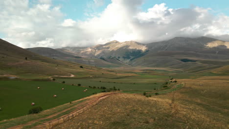 Green-Fields-Surrounded-By-Valleys-At-Umbria-Mountains-Near-Castelluccio-In-Central-Italy