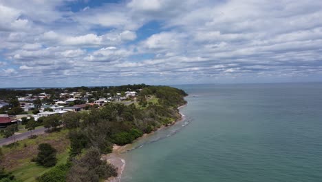 Aerial-view-of-a-beautiful-beach-and-a-small-beach-town-in-Australia