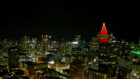 Drone-fly-by-on-top-of-downtown-Vancouver-Canada-during-the-night-through-Vancouver-lookout