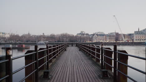 Beautiful-wide-angle-establishing-shot-pier-on-River-Thames-in-London